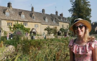 Me in front of golden cottages in Lower Slaughter